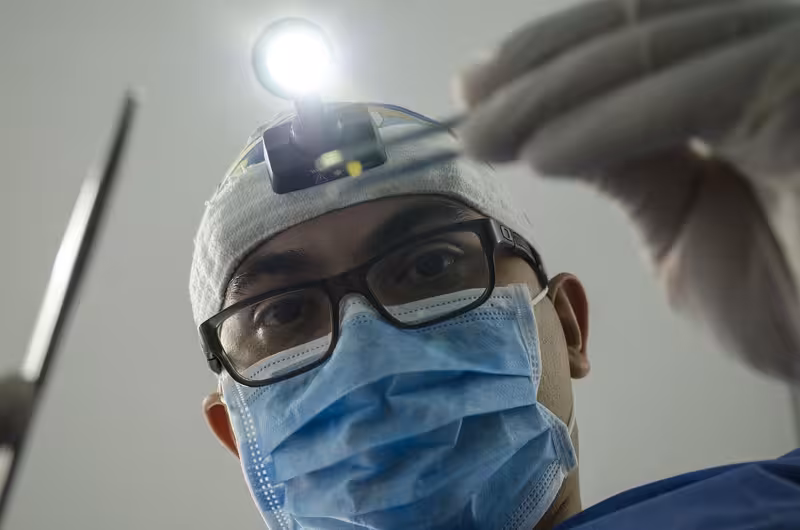 Choosing a Trustworthy Private Microsuction Clinic: A doctor in a clinic Doctor in clinic for Choosing a Trustworthy Private Microsuction Clinic - Best Guide To Enfield: Private Microsuction Ear Wa...